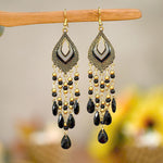 These Bohema Ethnic Fringed Tassel Earrings boast a stylish geometric shape and are crafted with a glossy acrylic water drop. Women of all ages will love wearing these beautiful metal earrings.