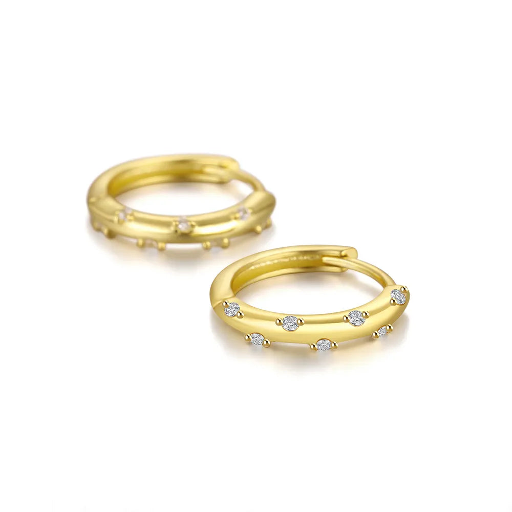 These small huggie earrings are made of 925 sterling silver with a glossy gold color finish, perfect for cartilage piercings. The fine jewelry accessories are designed to add a touch of elegance to any outfit.