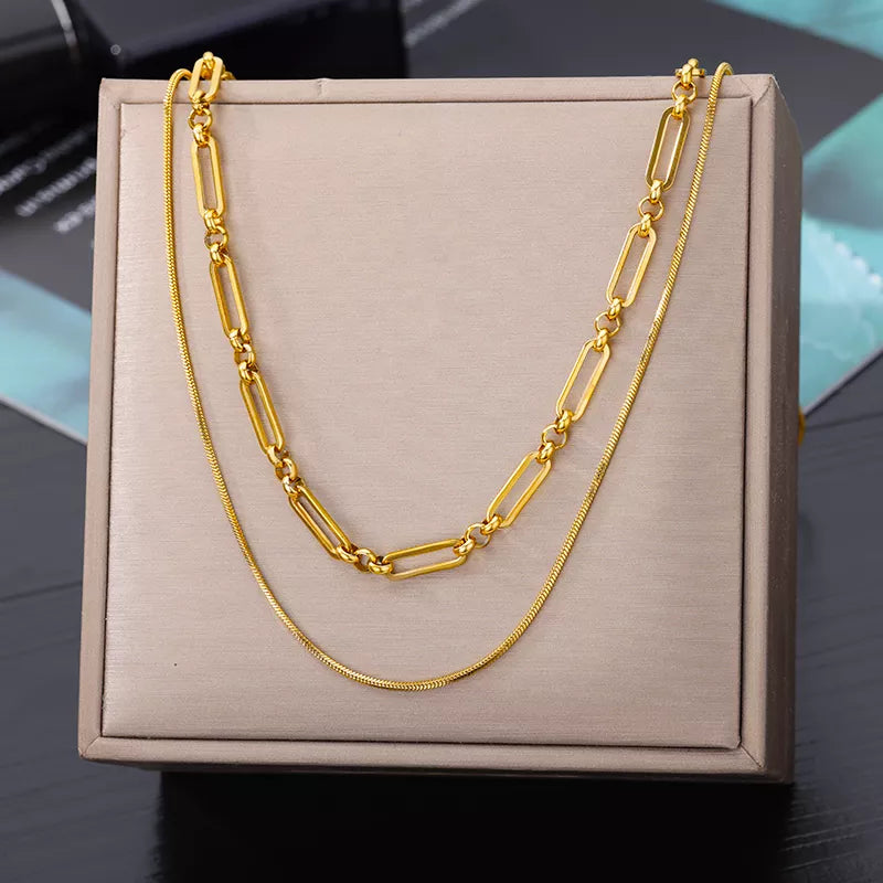 This necklace features a multilayer chain with a pendant in the shape of a star, moon, and butterfly. It is made of stainless steel and is designed as a choker necklace. It is a perfect accessory for women's wedding attire .