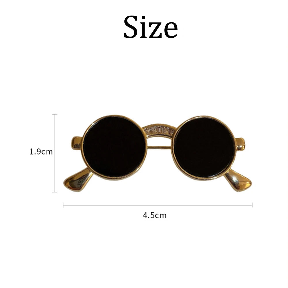 Unique vintage metal glasses shaped pins that add a touch of punk style to your outfit. These mini sunglasses brooches are perfect for both women and men, making them versatile accessories for any party or special occasion. Elevate your clothing game with these trendy and eye-catching pieces.