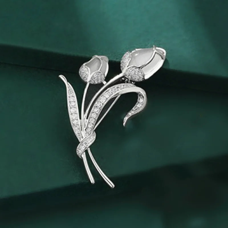 A stunning collection of opal stone and rhinestone brooches featuring rose flower designs. These exquisite brooches are perfect for women to accessorize their fashion clothing, especially for weddings. They make wonderful gifts for any occasion and are a must-have addition to any jewelry collection.