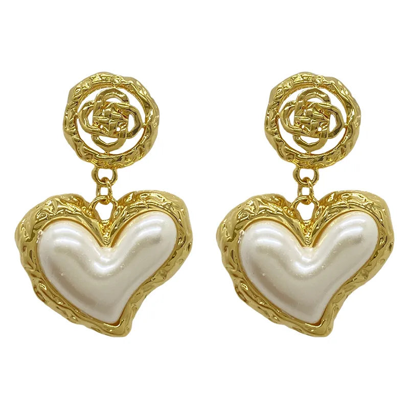 The latest addition to our collection, the Flower Heart Earrings . These French-inspired retro fashion accessories are the epitome of luxury, designed exclusively for women. Perfect for weddings and special occasions, these earrings are a must-have in every jewelry collection.