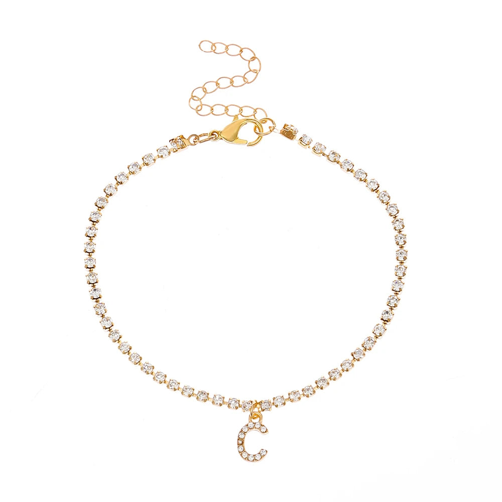 This ankle bracelet features an initial letter design with crystal zircon accents, perfect for women looking for a stylish foot chain to wear at the beach or as boho jewelry.