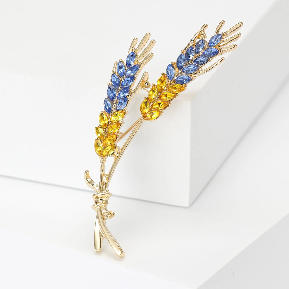 Elevate your style with these exquisite Korean fashion-inspired women's brooches. Crafted with attention to detail, these lapel pins feature a stunning 3-color rhinestone design resembling an ear of wheat. Perfect for adding a touch of luxury to your clothing, these jewelry accessories are a must-have for any fashion enthusiast.