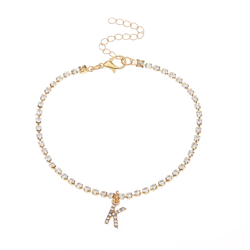 This ankle bracelet features an initial letter design with crystal zircon accents, perfect for women looking for a stylish foot chain to wear at the beach or as boho jewelry.