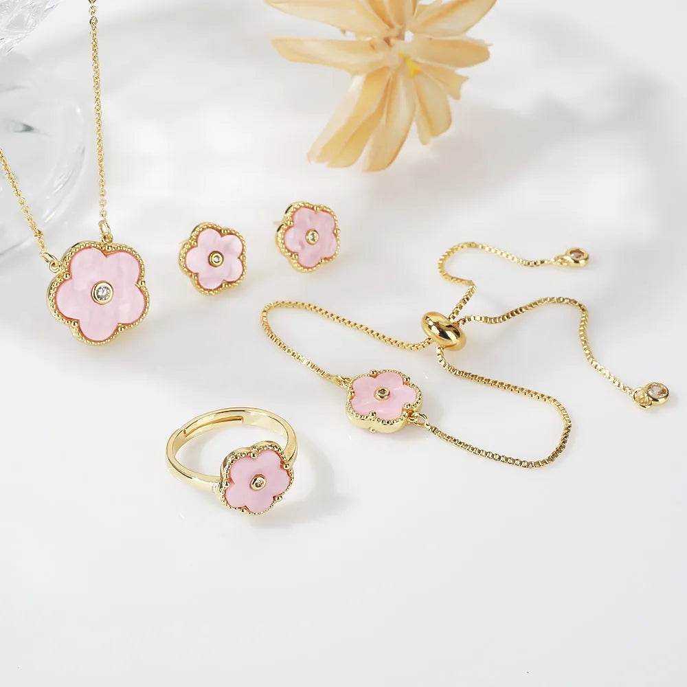 The exquisite elegance of our exclusive 18K gold plated Clover Flower Necklace Earrings Bracelet Ring Women Set. This stunning jewelry set is not only a symbol of luxury but also a perfect gift for any bride. Don't miss out on our limited-time offer with a low price that will leave you amazed.