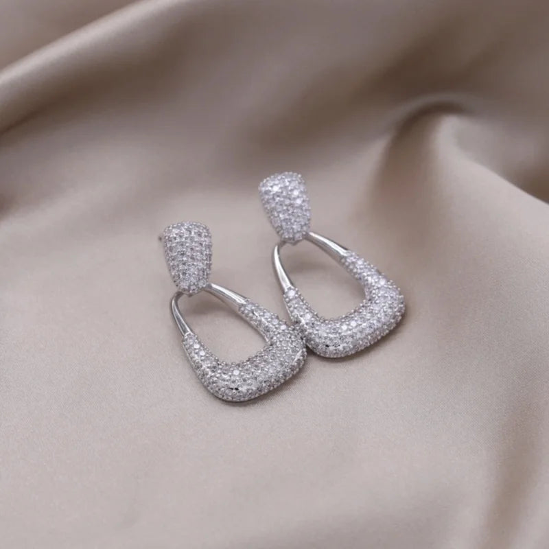 Introducing the elegant women's wedding party accessories, we present the luxurious square zircon pendant earrings in 16K gold plated fashion jewelry from Korea. This new design is sure to add a touch of sophistication to any outfit.