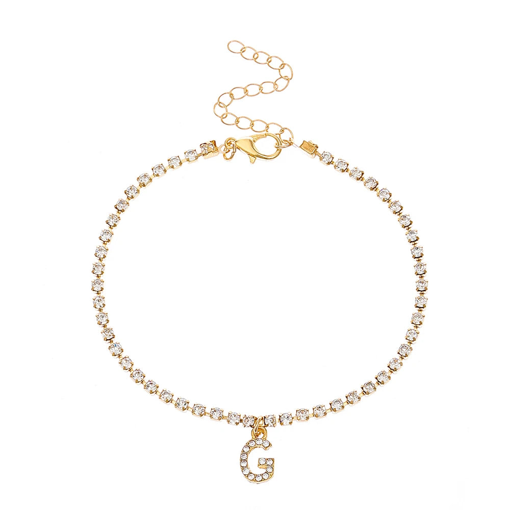 This ankle bracelet features an initial letter design with crystal zircon accents, perfect for women looking for a stylish foot chain to wear at the beach or as boho jewelry.