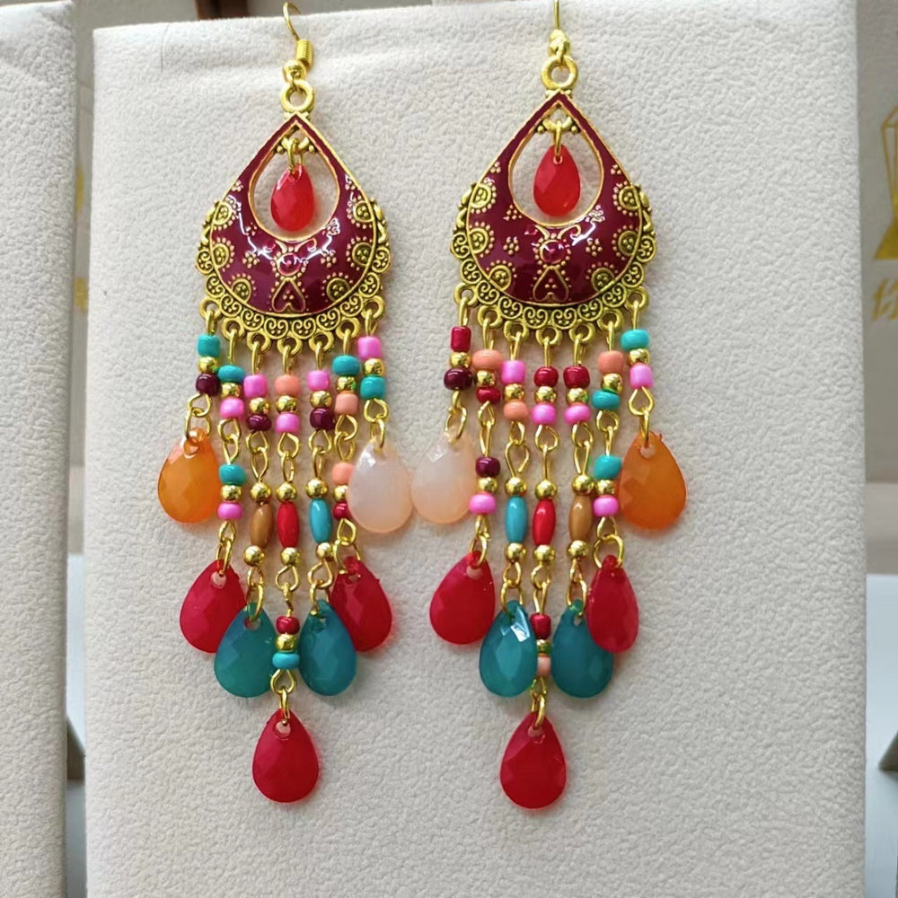 These Bohema Ethnic Fringed Tassel Earrings boast a stylish geometric shape and are crafted with a glossy acrylic water drop. Women of all ages will love wearing these beautiful metal earrings.