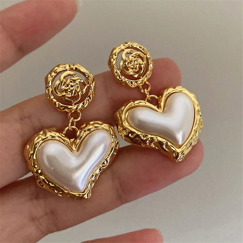 The latest addition to our collection, the Flower Heart Earrings . These French-inspired retro fashion accessories are the epitome of luxury, designed exclusively for women. Perfect for weddings and special occasions, these earrings are a must-have in every jewelry collection.