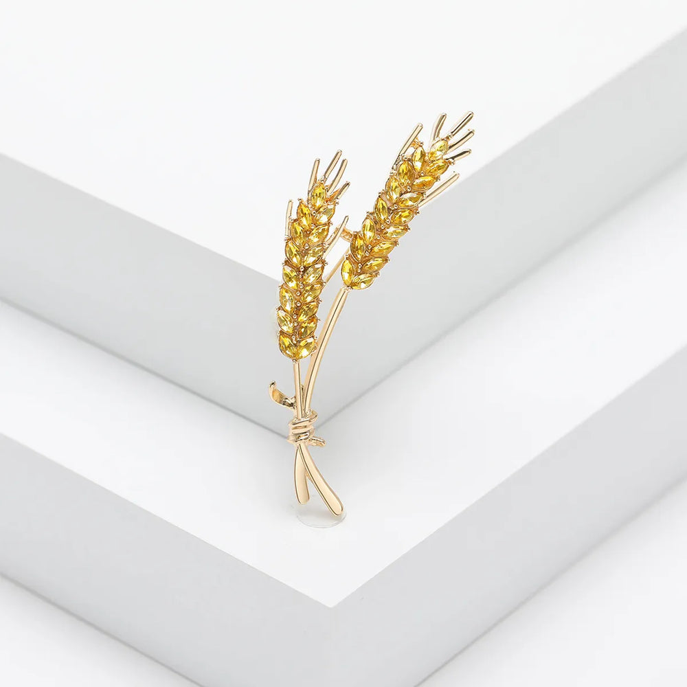 Elevate your style with these exquisite Korean fashion-inspired women's brooches. Crafted with attention to detail, these lapel pins feature a stunning 3-color rhinestone design resembling an ear of wheat. Perfect for adding a touch of luxury to your clothing, these jewelry accessories are a must-have for any fashion enthusiast.