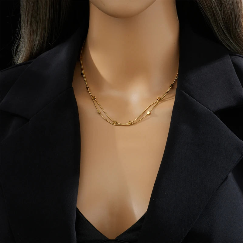 This necklace is made of 316L stainless steel and features a 2-in-1 design with small cube chains. It is available in gold and silver colors, making it a stylish accessory for women. This choker necklace is perfect for parties and also makes a great jewelry gift for girls.