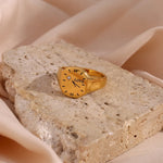 This trendy 18K gold-plated ring for women is a romantic clock LOVE ring made of stainless steel. It is a waterproof jewelry gift that exudes French charm.