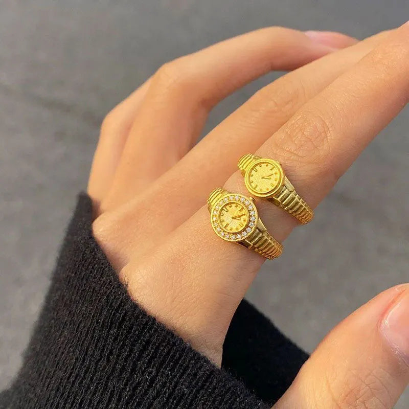 The elegance of the Zircon Mini Watch Ring, a stunning piece of jewelry designed for women. Crafted from gold-colored stainless steel, this adjustable 520 watch ring is perfect for weddings or as a thoughtful gift. Embrace the beauty of this aesthetic jewelry and surprise the special woman in your life with this exquisite femme.