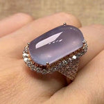 The elegance of our exquisite silver-colored engagement and wedding rings for women, adorned with luxury rectangle light purple zircon stones. This fashion jewelry is designed to add a touch of sophistication to any outfit.