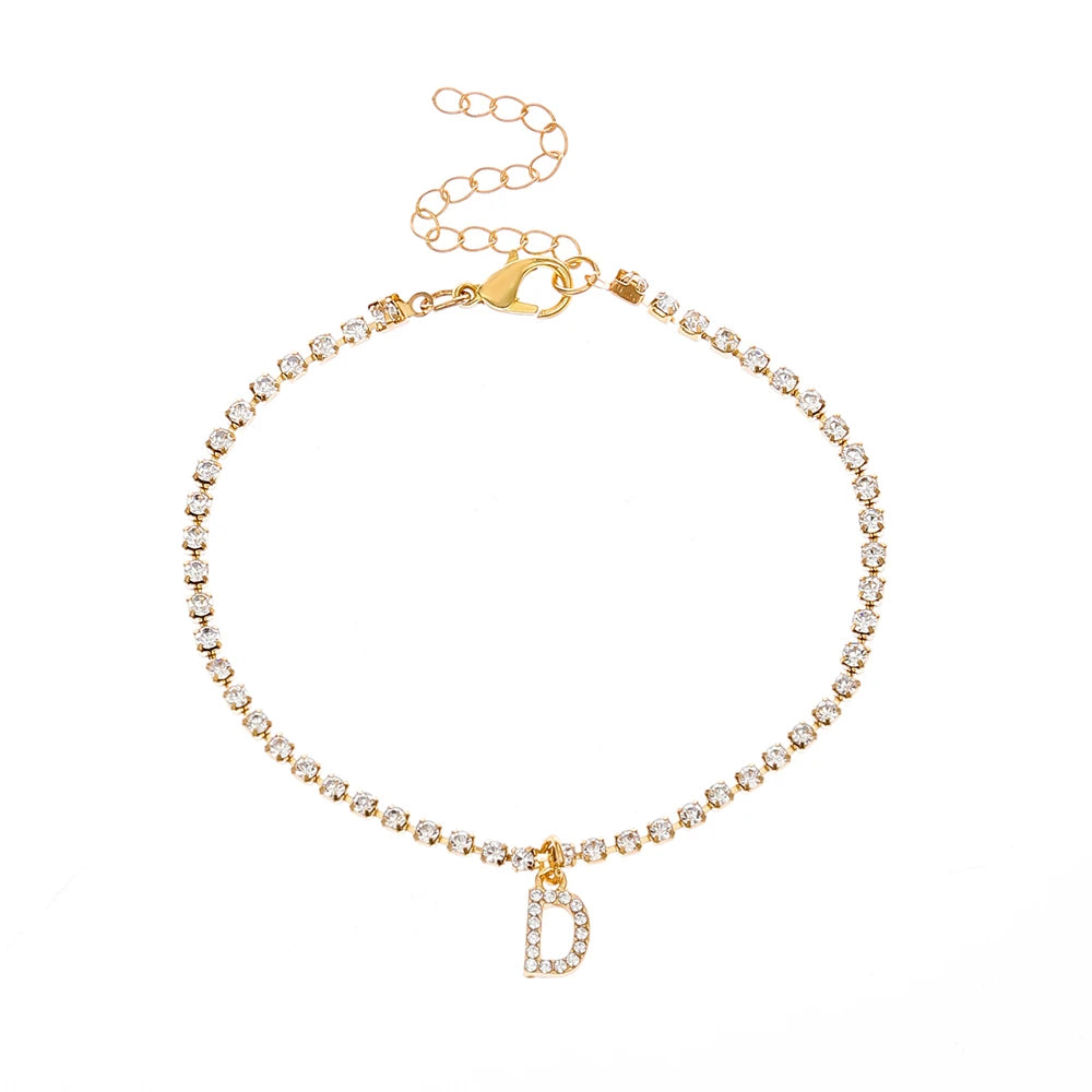 This ankle bracelet features an initial letter design with crystal zircon accents, perfect for women looking for a stylish foot chain to wear at the beach or as boho jewelry.