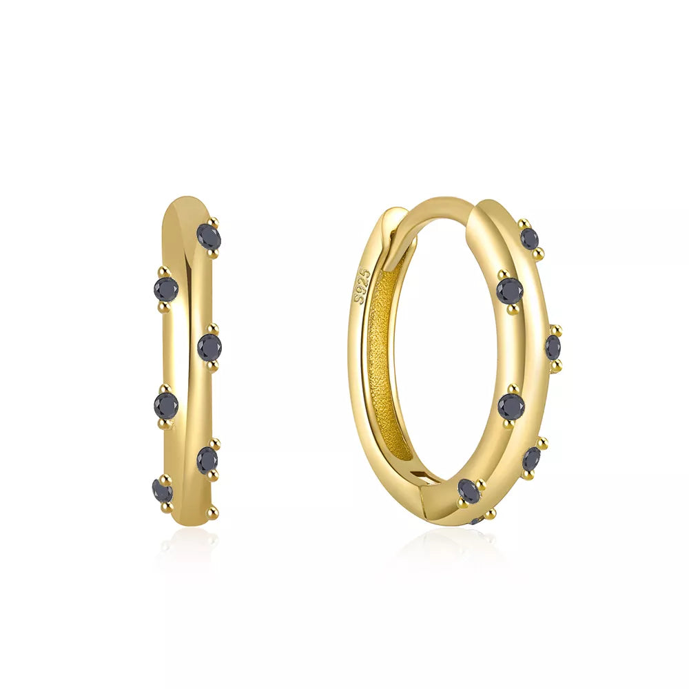 These small huggie earrings are made of 925 sterling silver with a glossy gold color finish, perfect for cartilage piercings. The fine jewelry accessories are designed to add a touch of elegance to any outfit.