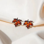 The allure of these exquisite French vintage earrings adorned with red maple leaf crystals and zircon stones. These elegant tassel earrings are designed to enhance a woman's temperament and add a touch of glamour to any party ensemble. They make a perfect gift for someone special who appreciates fine jewelry.