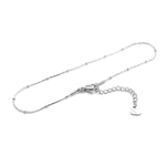 This anklet is made of 304 stainless steel and features a round heart chain design in a silver color, perfect for women to wear during the summer at the beach.