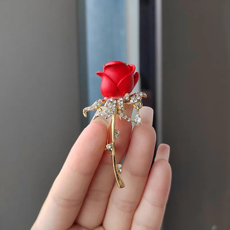A stunning collection of opal stone and rhinestone brooches featuring rose flower designs. These exquisite brooches are perfect for women to accessorize their fashion clothing, especially for weddings. They make wonderful gifts for any occasion and are a must-have addition to any jewelry collection.