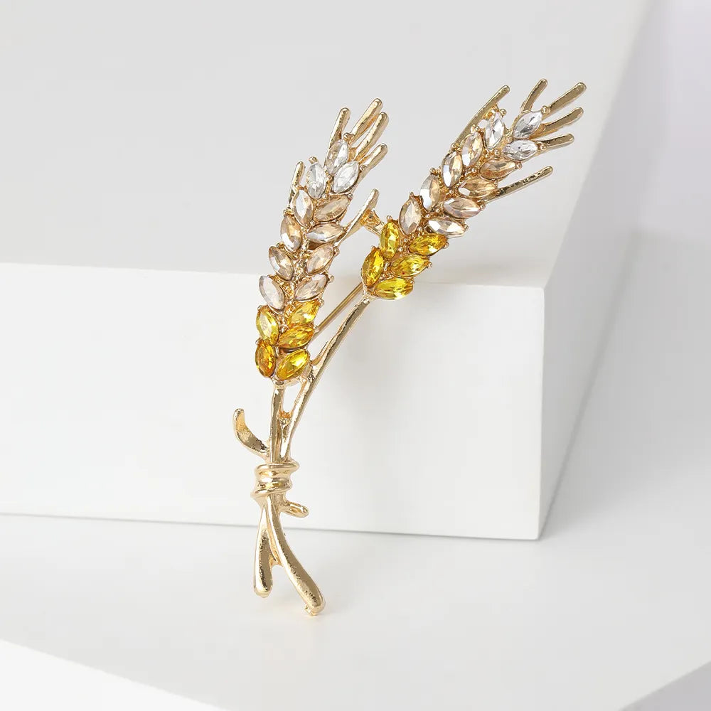 Elevate your style with these exquisite Korean fashion-inspired women's brooches. Crafted with attention to detail, these lapel pins feature a stunning 3-color rhinestone design resembling an ear of wheat. Perfect for adding a touch of luxury to your clothing, these jewelry accessories are a must-have for any fashion enthusiast.