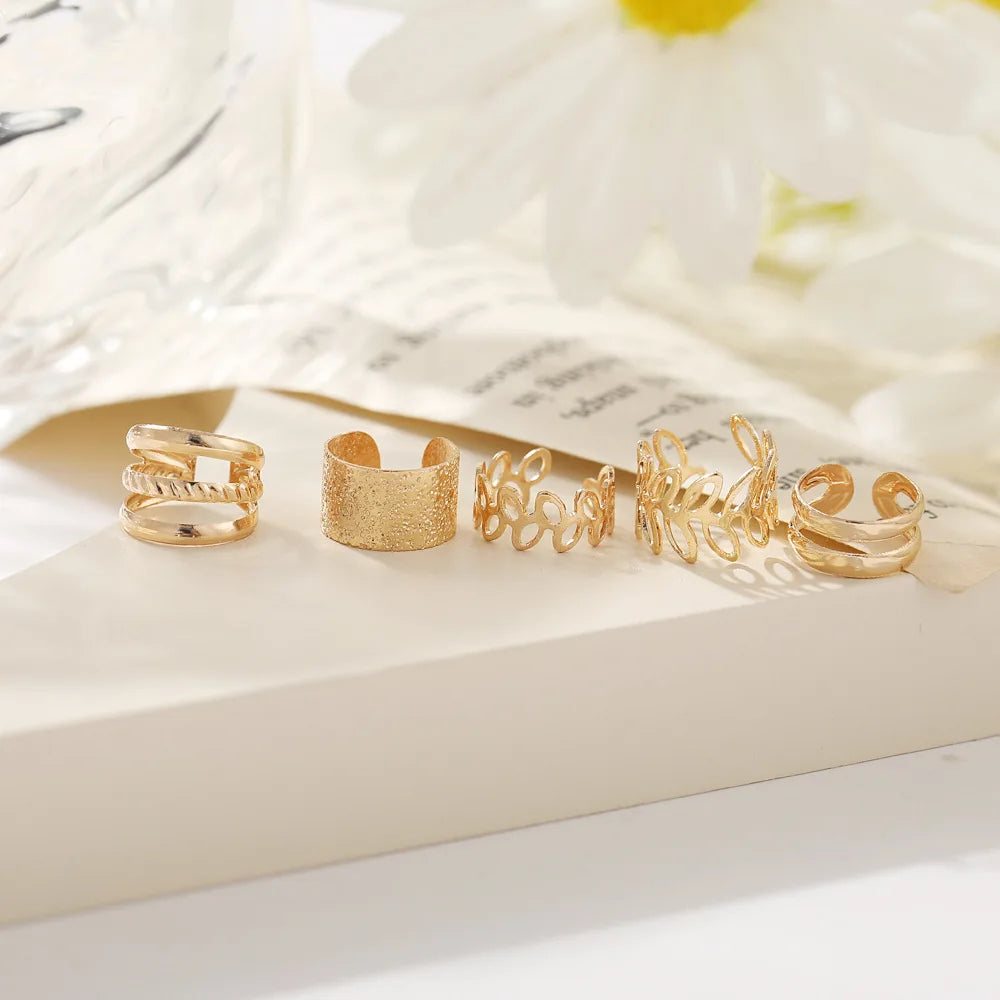 This set includes five pieces of vintage-style gold color leaf ear cuffs that do not require piercing, designed as fake cartilage clip earrings suitable for both women and men who appreciate creative and trendy jewelry pieces.