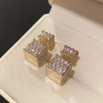 The exquisite earrings adorned with dazzling zircon gemstones, radiating elegance and sophistication. These square golden earrings are a symbol of luxury and make for the perfect Christmas gift for women, adding a touch of cuteness to any outfit.