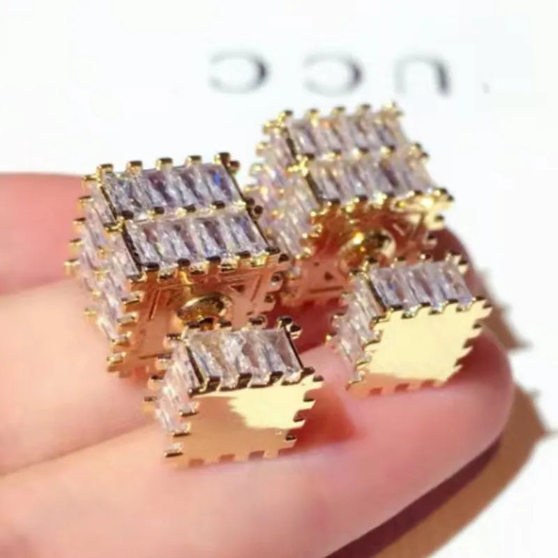 The exquisite earrings adorned with dazzling zircon gemstones, radiating elegance and sophistication. These square golden earrings are a symbol of luxury and make for the perfect Christmas gift for women, adding a touch of cuteness to any outfit.