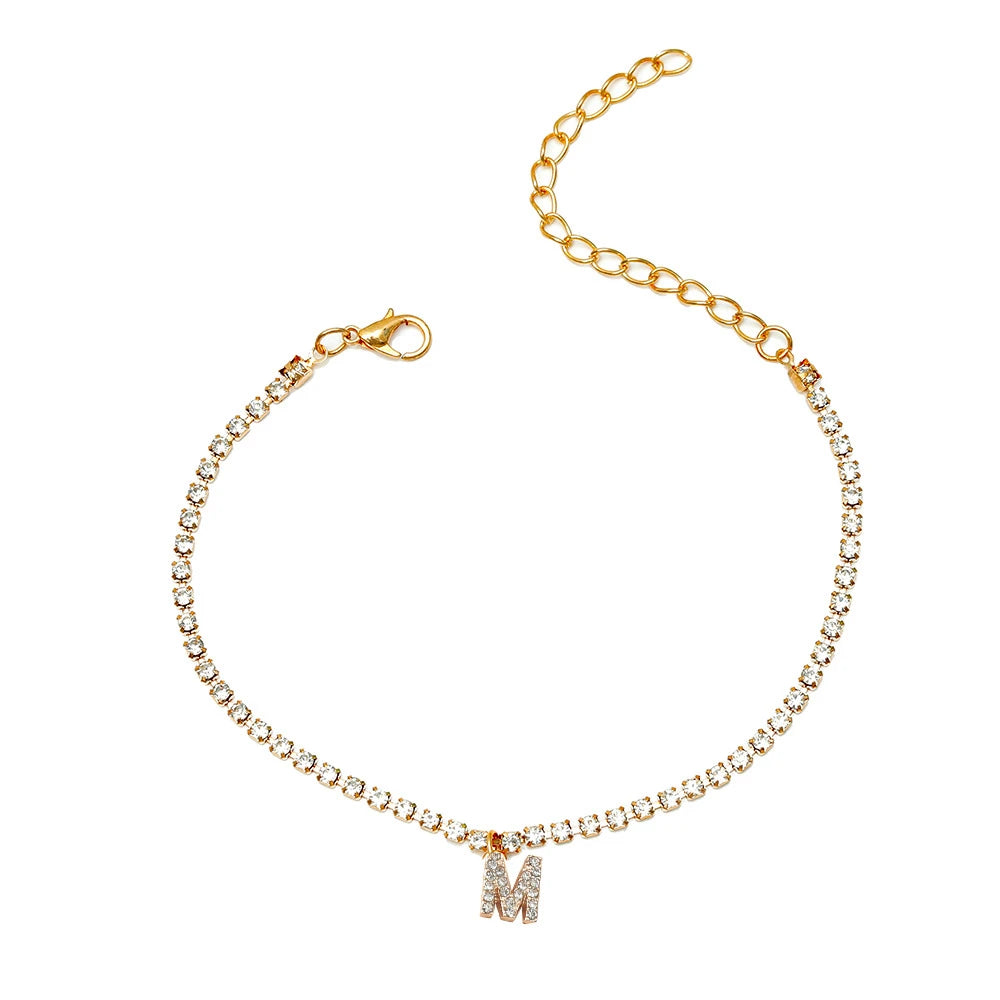 This ankle bracelet features an initial letter design with crystal zircon accents, perfect for women looking for a stylish foot chain to wear at the beach or as boho jewelry.