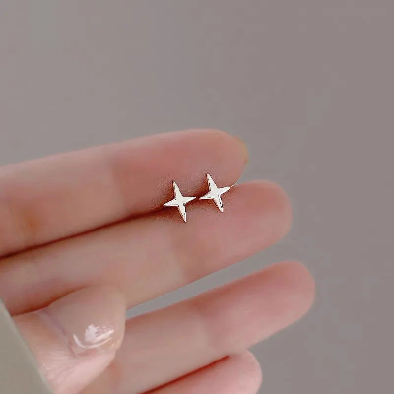 Elegant and minimalist stud earrings designed for women, featuring star and moon motifs with sparkling zircon stones. Crafted from high-quality 925 silver, these earrings are perfect for tragus and cartilage piercings, adding a touch of asymmetrical charm to your fine jewelry collection.