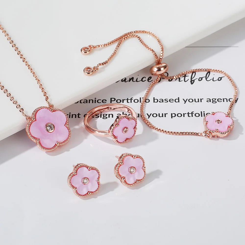 The exquisite elegance of our exclusive 18K gold plated Clover Flower Necklace Earrings Bracelet Ring Women Set. This stunning jewelry set is not only a symbol of luxury but also a perfect gift for any bride. Don't miss out on our limited-time offer with a low price that will leave you amazed.