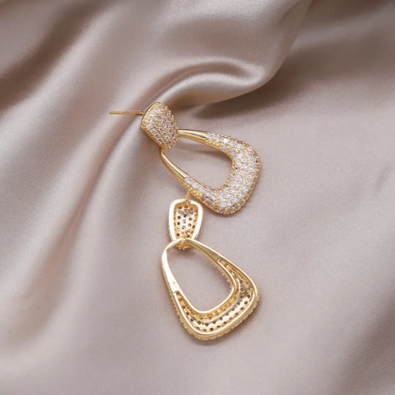 Introducing the elegant women's wedding party accessories, we present the luxurious square zircon pendant earrings in 16K gold plated fashion jewelry from Korea. This new design is sure to add a touch of sophistication to any outfit.