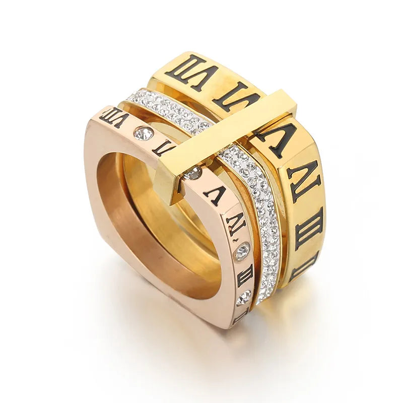 Elegant and stylish fashion jewelry with our collection of stainless steel rings for women. These rings feature black rhinestones and engraved Roman numerals, adding a touch of sophistication to any outfit. With three layers and a square design, these wedding bands are the perfect choice for those seeking a unique and fashionable accessory.