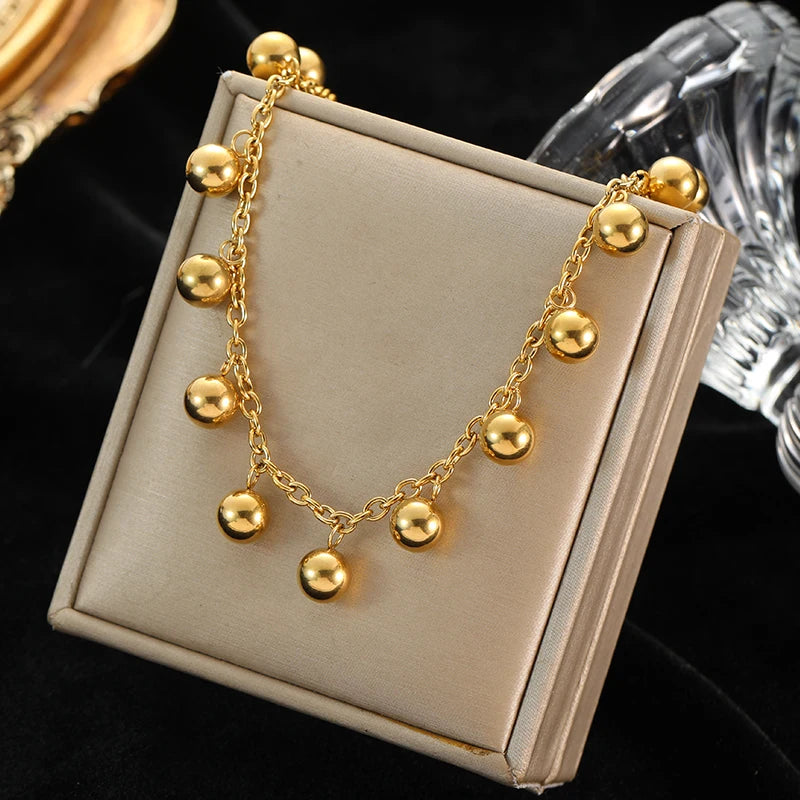 This necklace features hollow ball beads made of 316L stainless steel in a gold color, designed for women as a non-fading choker jewelry piece perfect for gifts or parties.