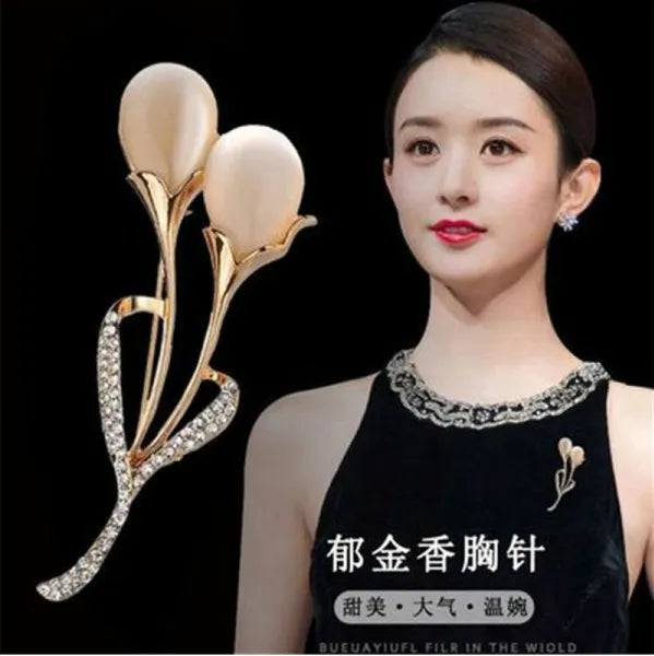 A stunning collection of opal stone and rhinestone brooches featuring rose flower designs. These exquisite brooches are perfect for women to accessorize their fashion clothing, especially for weddings. They make wonderful gifts for any occasion and are a must-have addition to any jewelry collection.